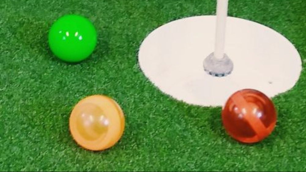 XP-3 Park Golf golf balls. The balls are translucent orange, green, and translucent red. Stripe and Star pattern available.